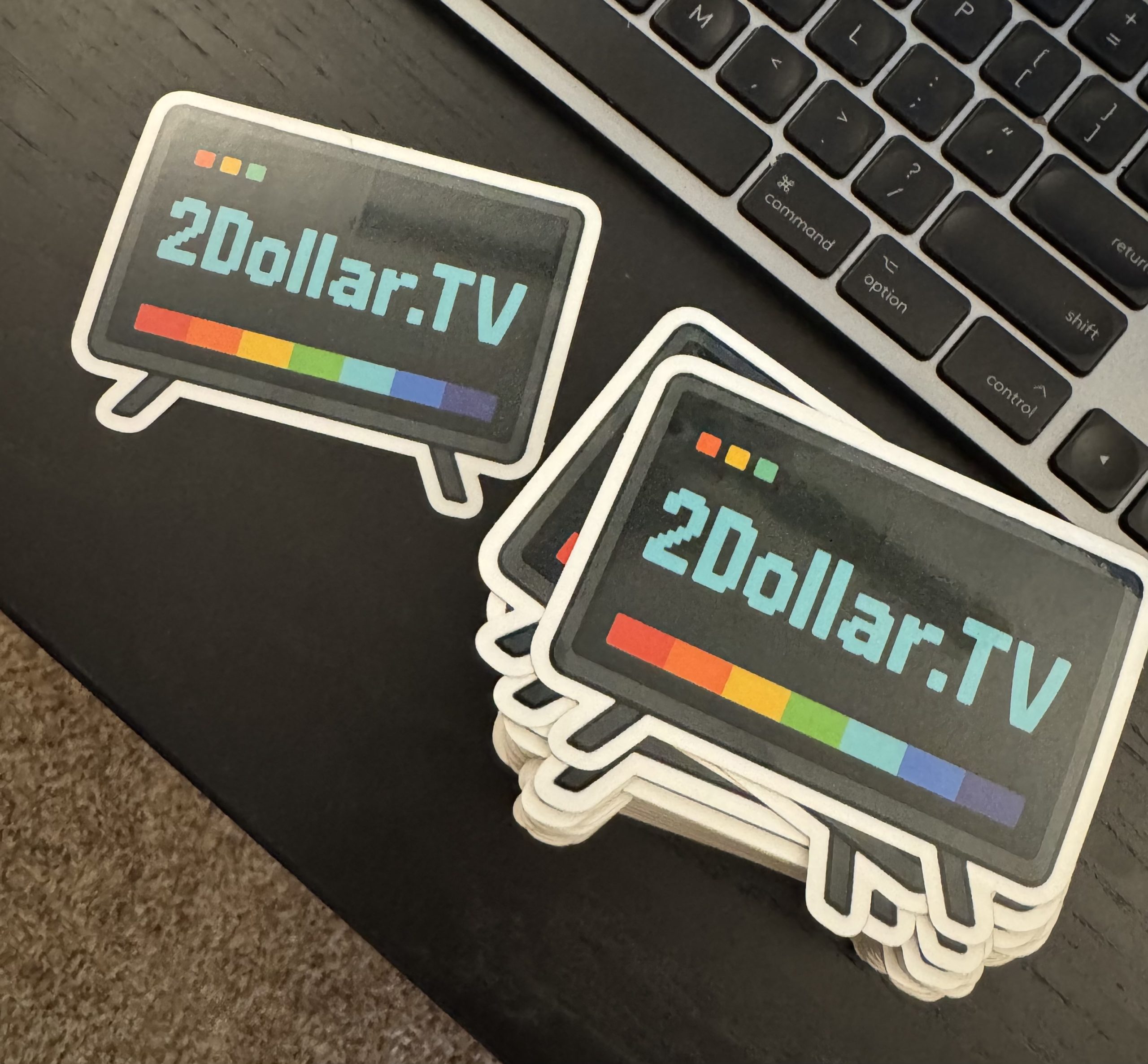 A pile of 2Dollar.TV stickers